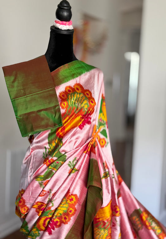 Light pink and green combination Pochampally handwoven ikat pure silk saree with peacock motif