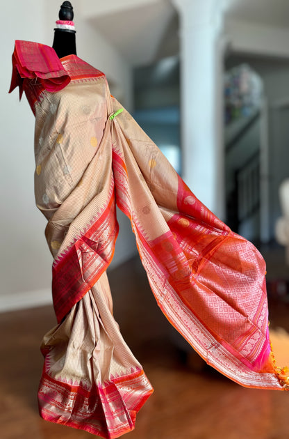 Handwoven Kuttu Gadwal pure Silk Saree in Beige color with orangish peach Checks body