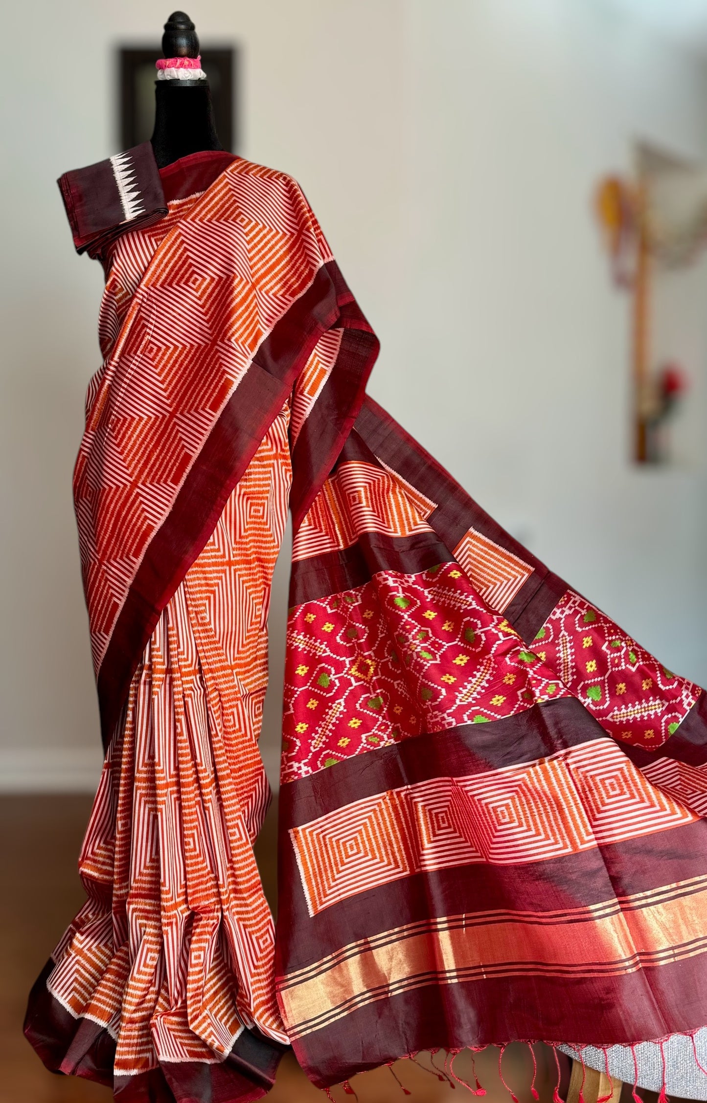 Orange and Brown combination Contemporary ikat pure silk saree with mirror effect body design