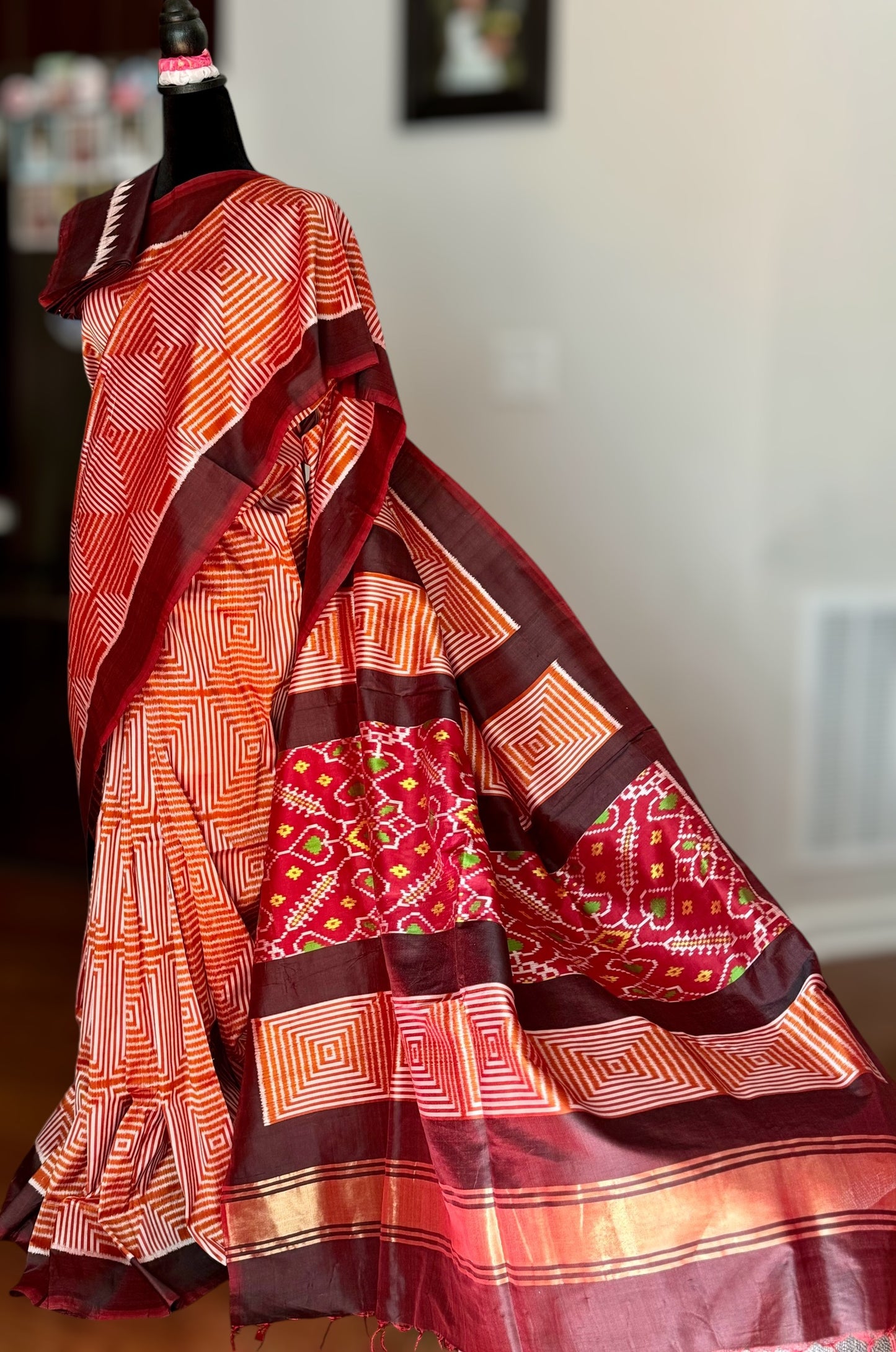 Orange and Brown combination Contemporary ikat pure silk saree with mirror effect body design