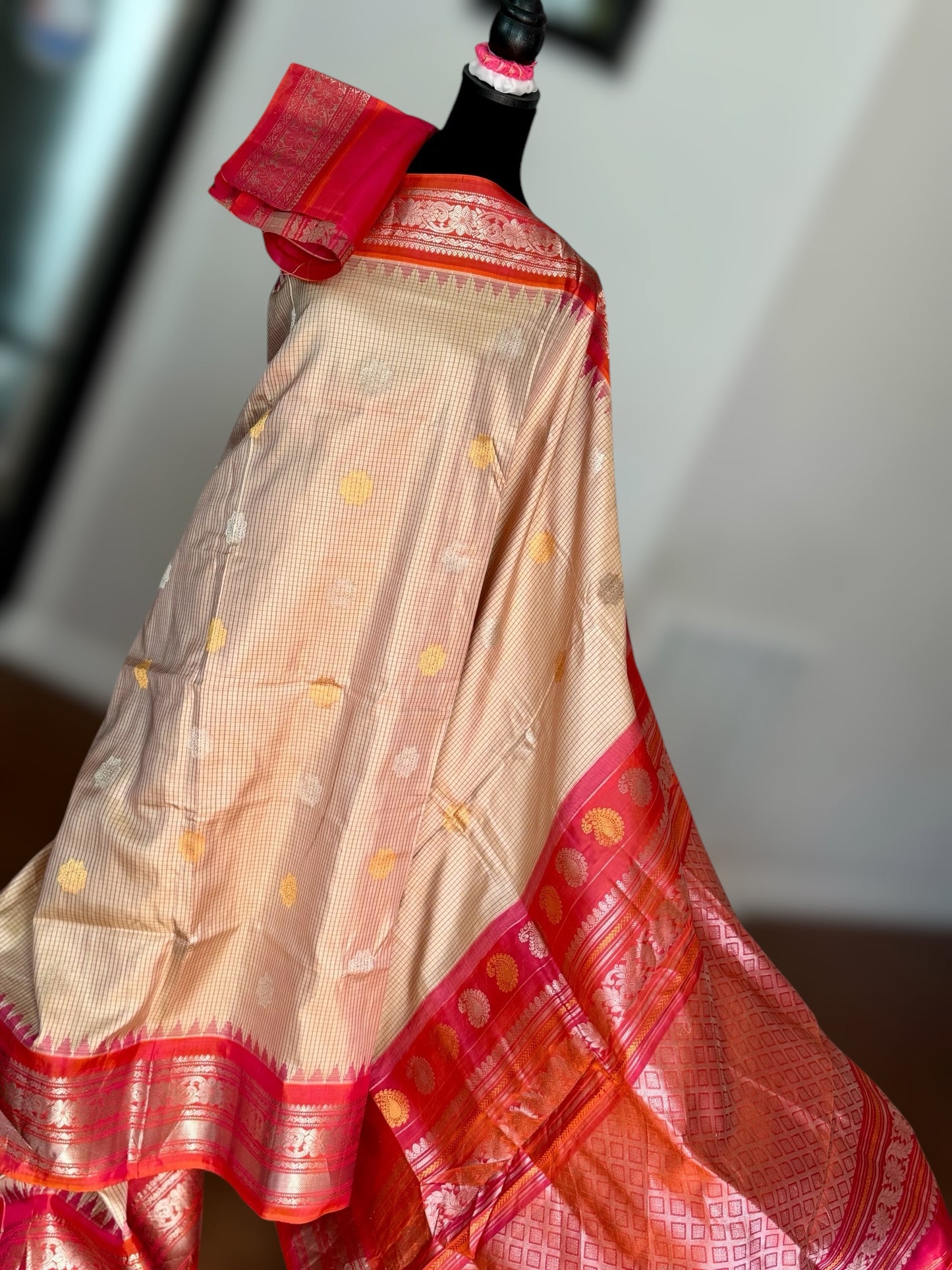 Handwoven Kuttu Gadwal pure Silk Saree in Beige color with orangish peach Checks body