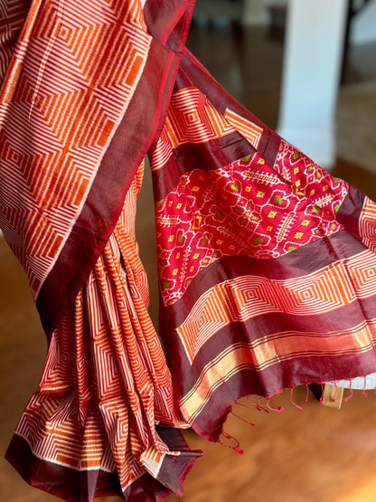 Orange and Brown combination Contemporary ikat pure silk saree with mirror effect body design