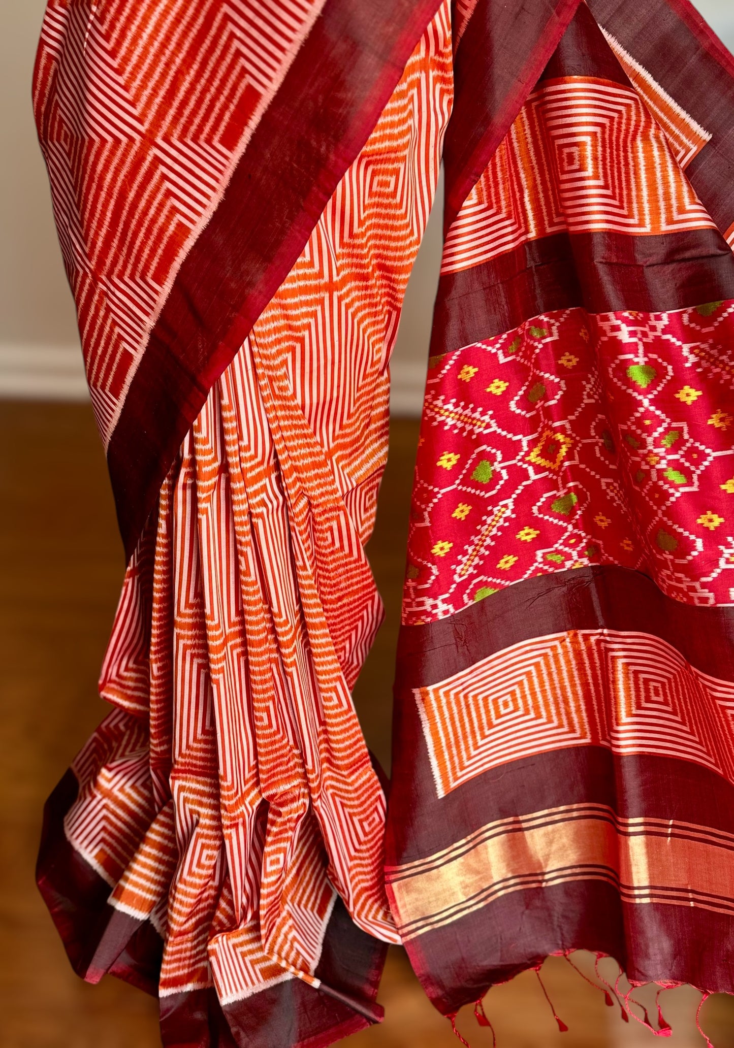 Orange and Brown combination Contemporary ikat pure silk saree with mirror effect body design