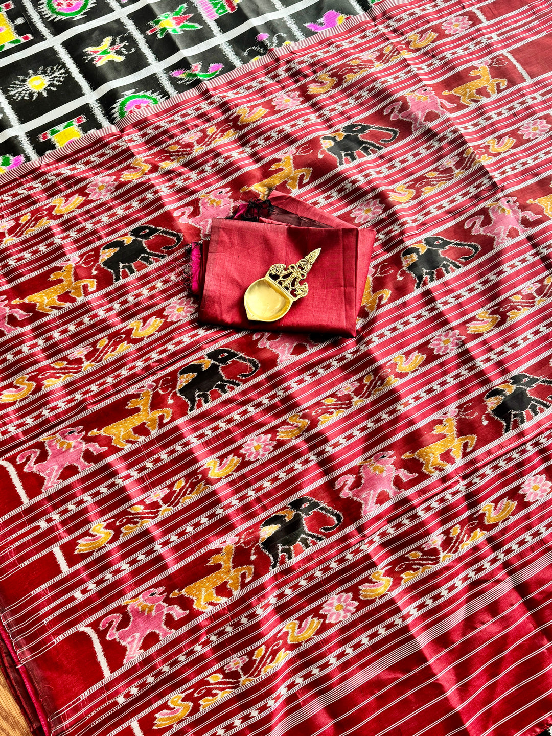 Black with red combinations Contemporary ikkat pure silk saree with Nabakothi theme