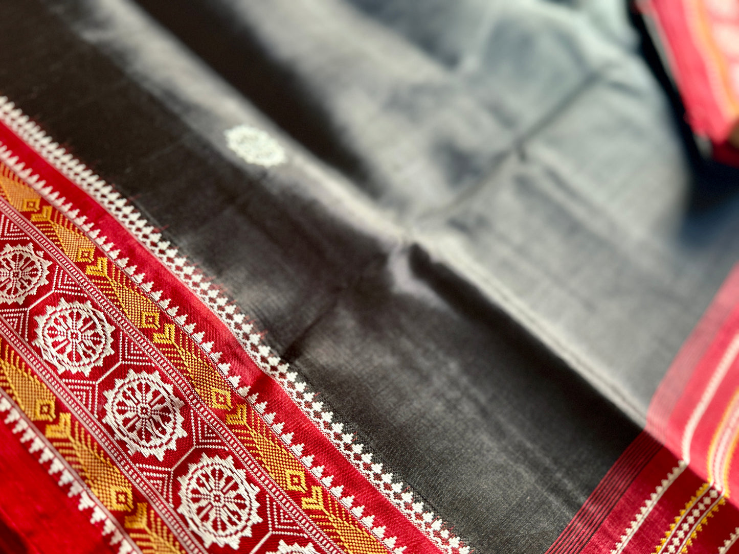 Black with red combinations contemporary ikat from Odisha weaves with konark chakra jala weaving