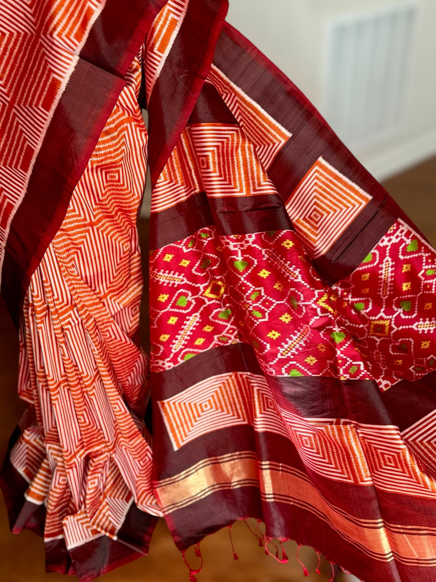 Orange and Brown combination Contemporary ikat pure silk saree with mirror effect body design