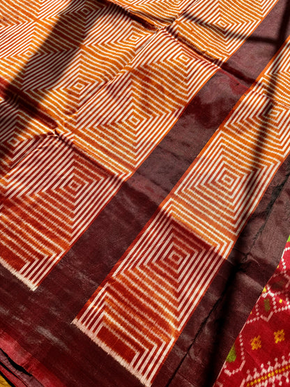 Orange and Brown combination Contemporary ikat pure silk saree with mirror effect body design