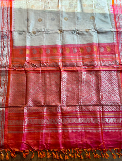 Handwoven Kuttu Gadwal pure Silk Saree in Beige color with orangish peach Checks body