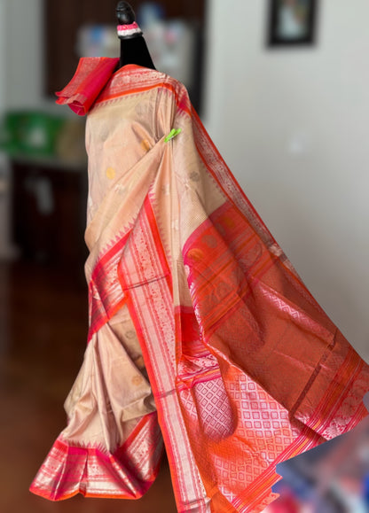 Handwoven Kuttu Gadwal pure Silk Saree in Beige color with orangish peach Checks body