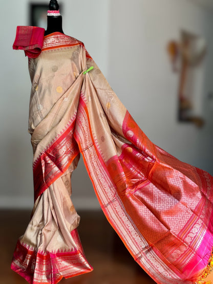 Handwoven Kuttu Gadwal pure Silk Saree in Beige color with orangish peach Checks body