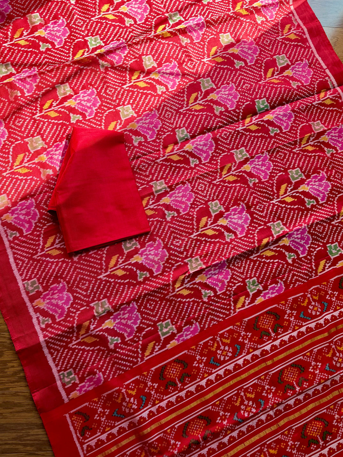 Red color single ikat patan Patola pure silk saree (aka semi-double ikat)